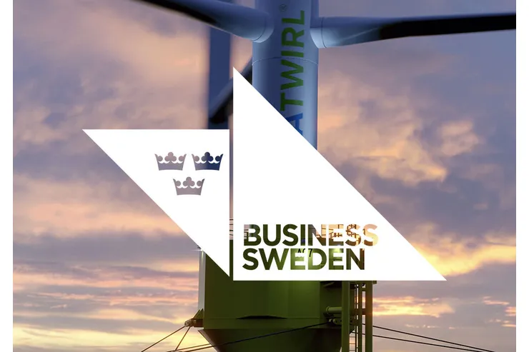 Vindkraftverket i solnedgång med Business Swedens logotyp i en vit triangel över bilden