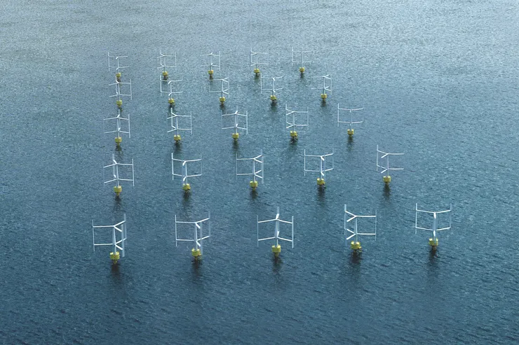 Vindkraftpark med vertikalaxlade verk i formation på havet, sedd snett uppifrån